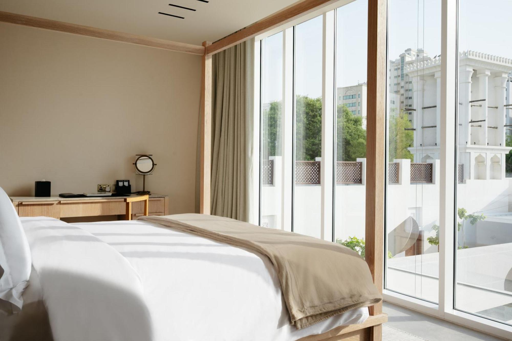 Отель The Chedi Al Bait, Шарджа Экстерьер фото A bedroom with a sliding door